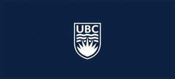 White UBC crest on a dark blue background